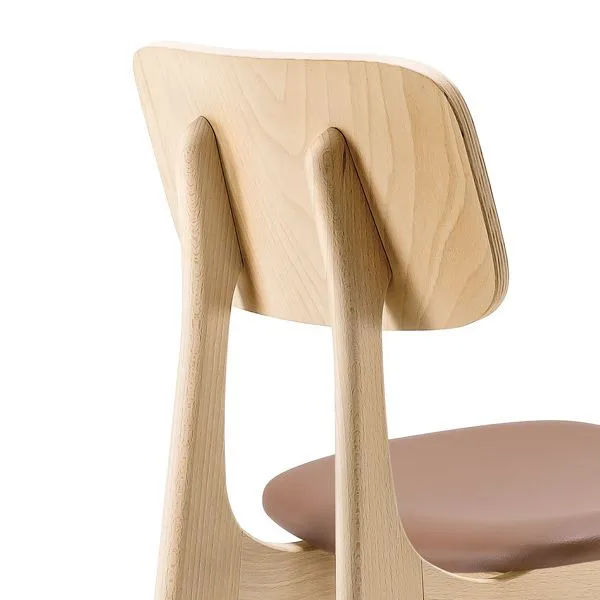 Taburete estilizado con asiento tapizado